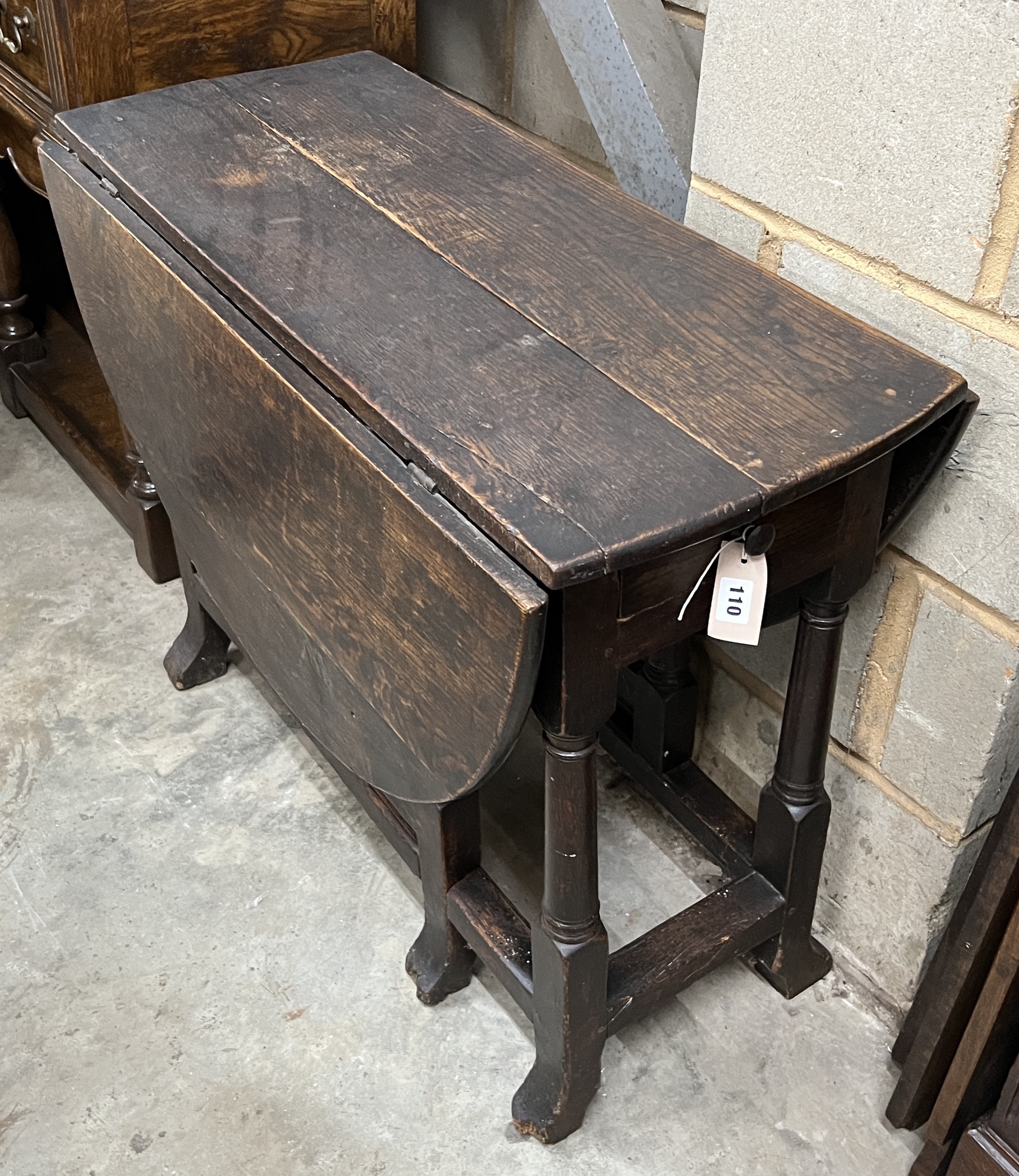 A small 18th century oak gateleg table, width 90cm, length 118cm extended, height 70cm